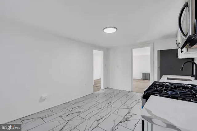 a bedroom with a bed and a stove