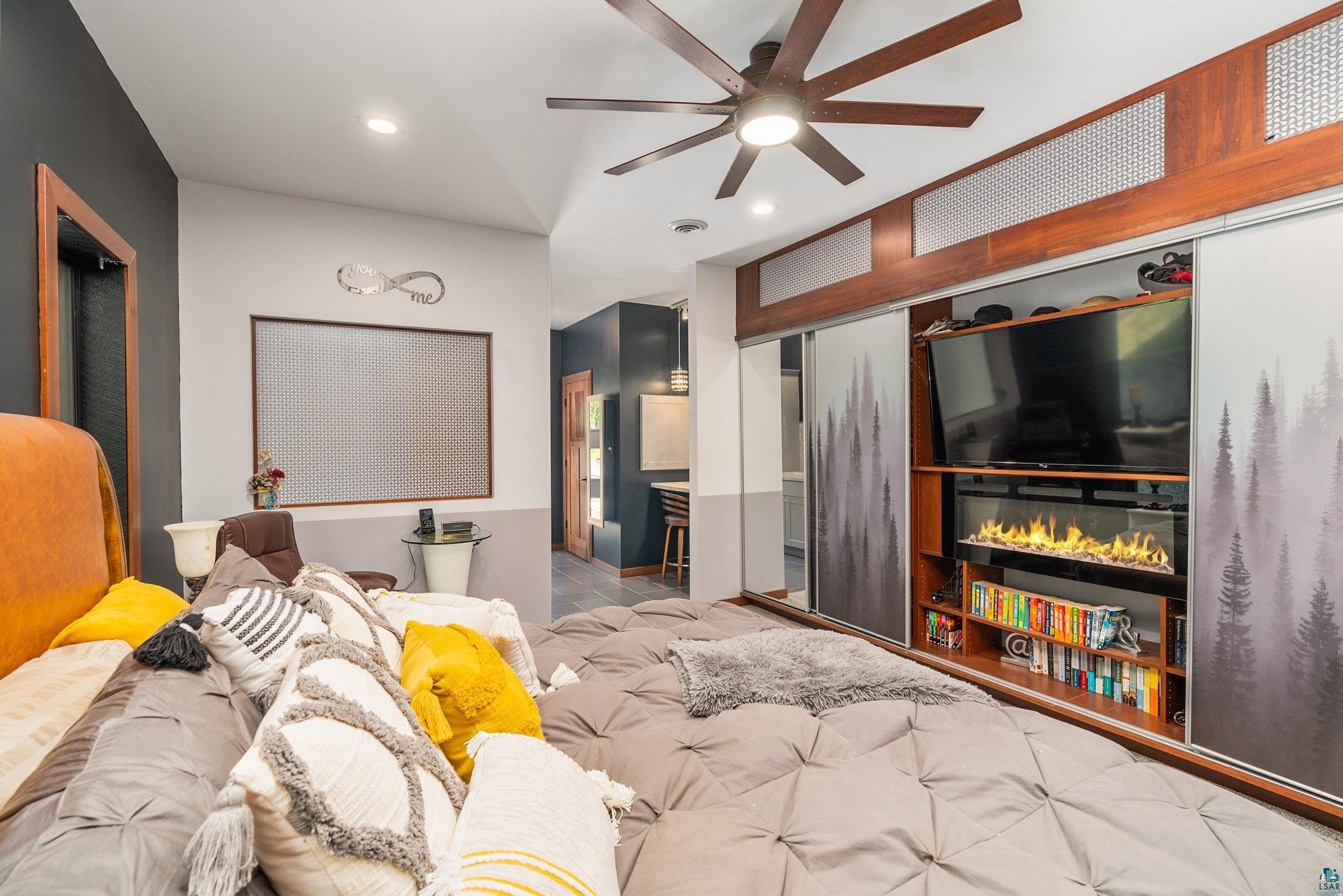 5196 Eagle Lake Road Duluth, MN 55803 - Photo 16 of 50 Interior space featuring ceiling fan, light tile patterned flooring, and a closet