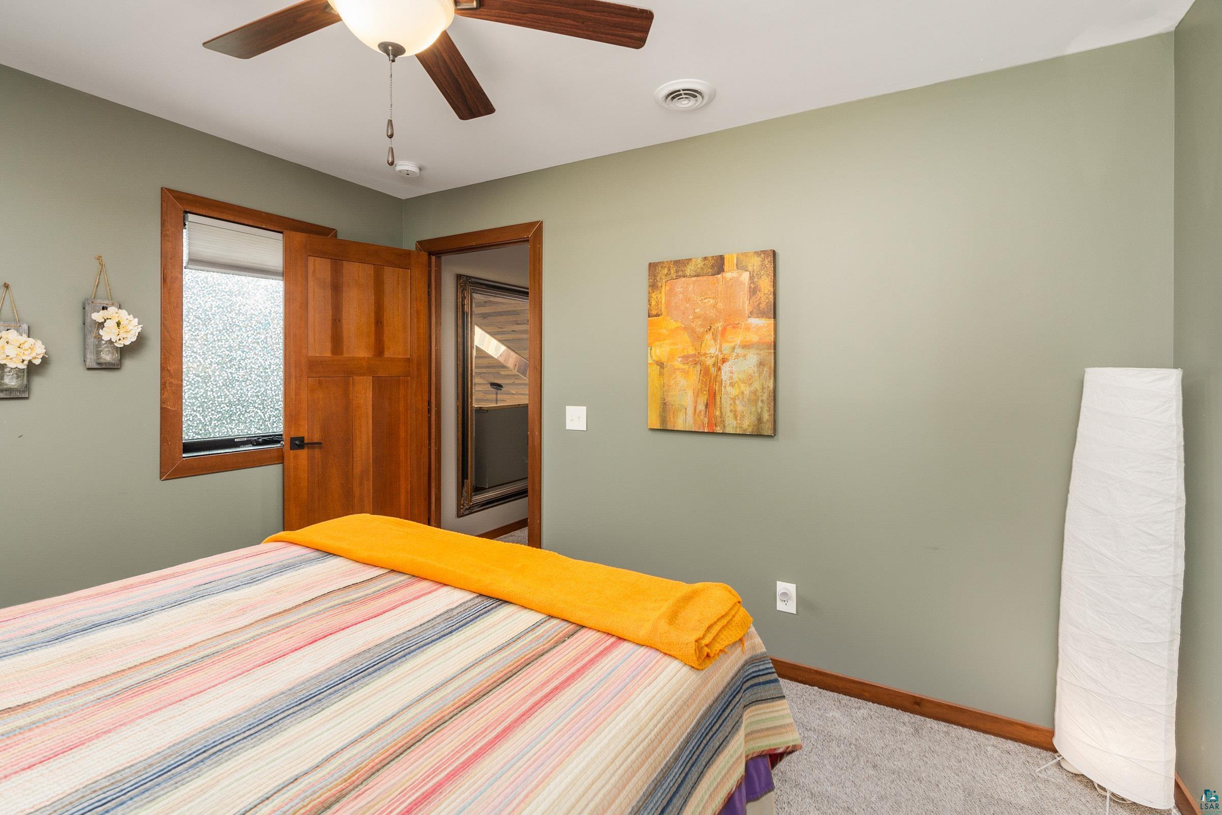 5196 Eagle Lake Road Duluth, MN 55803 - Photo 27 of 50 Bedroom with ceiling fan and carpet floors