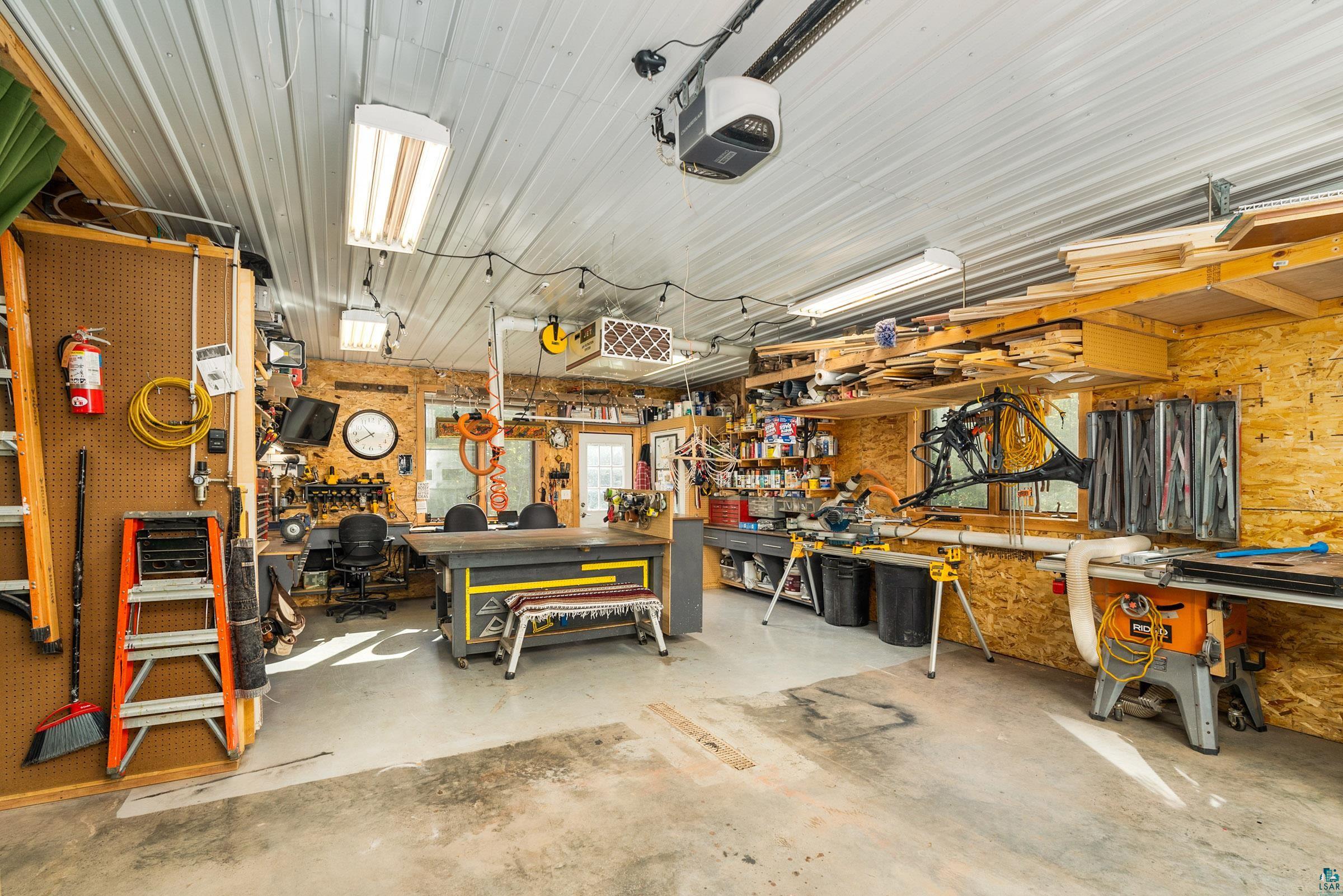 5196 Eagle Lake Road Duluth, MN 55803 - Photo 40 of 50 Garage featuring a workshop area and a garage door opener