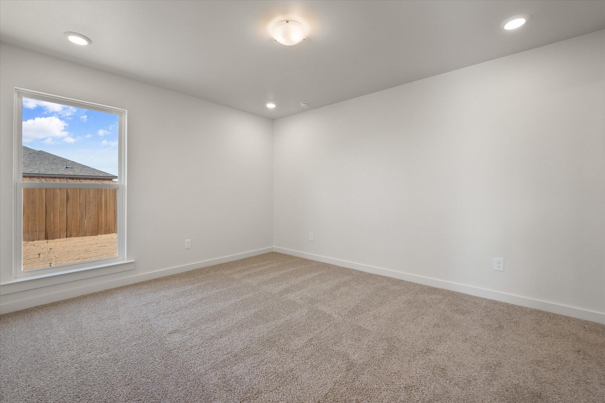 1603 North Clinton Avenue Lubbock, TX 79416 - Photo 13 of 14 an empty room with a window