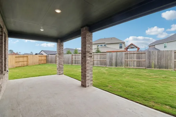 a view of a house with backyard and a garden