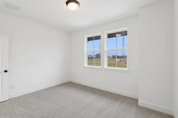 a bathroom with a granite countertop sink mirror toilet and bathtub