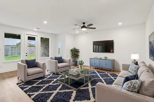 a living room with furniture and a flat screen tv
