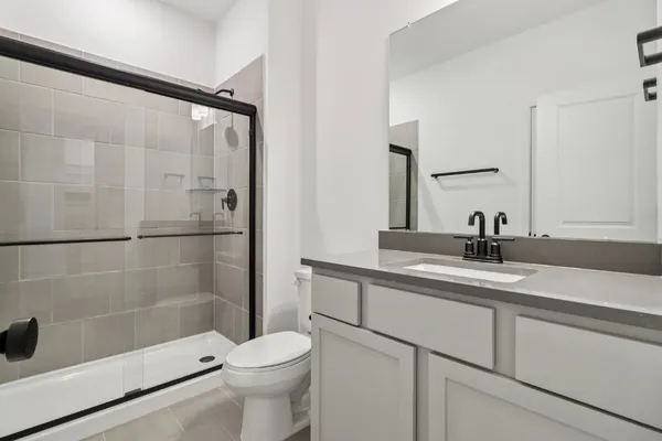 a swimming pool with yard in front of it