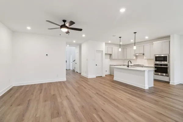 a view of kitchen with wooden floor and window