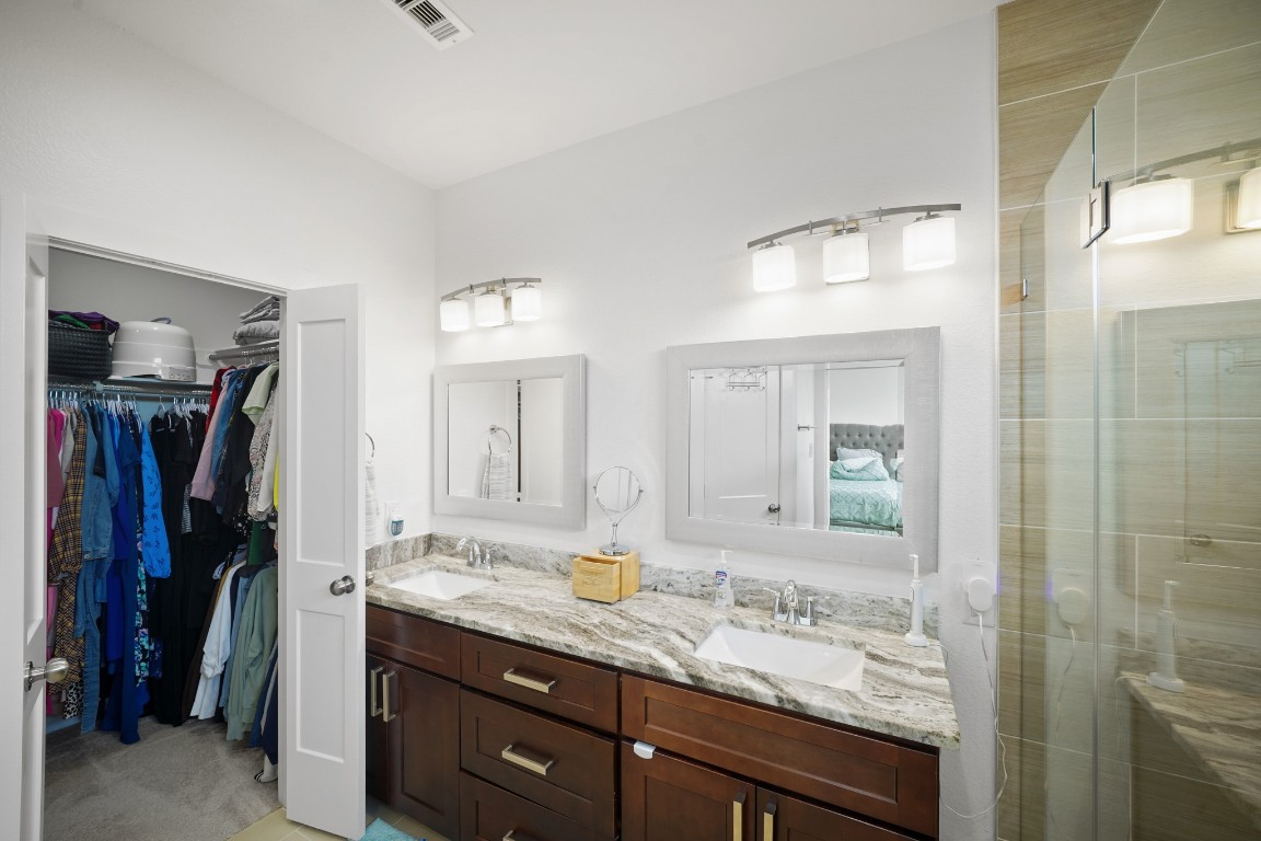 4402 McKinley Street, Unit B Houston, TX 77051 - Photo 10 of 21 Primary with dual sink and a peak at the huge closet.