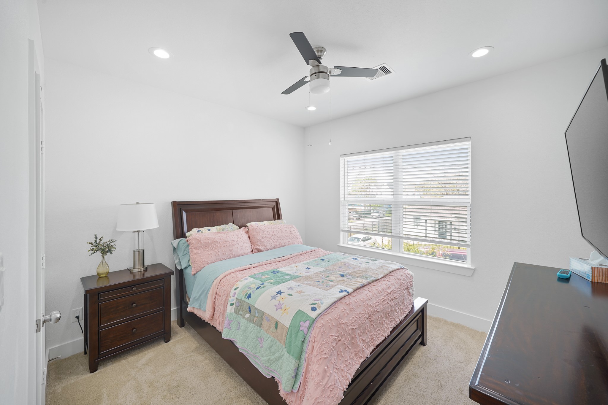4402 McKinley Street, Unit B Houston, TX 77051 - Photo 12 of 21 a bedroom with a bed and a window