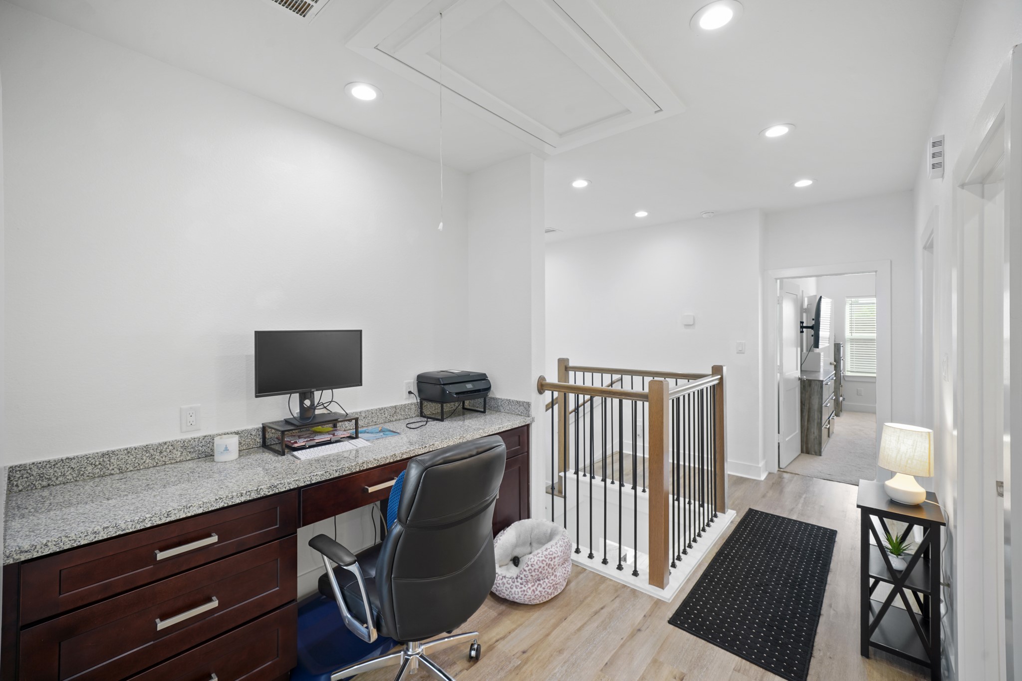 4402 McKinley Street, Unit B Houston, TX 77051 - Photo 15 of 21 a view of a workspace with furniture and wooden floor