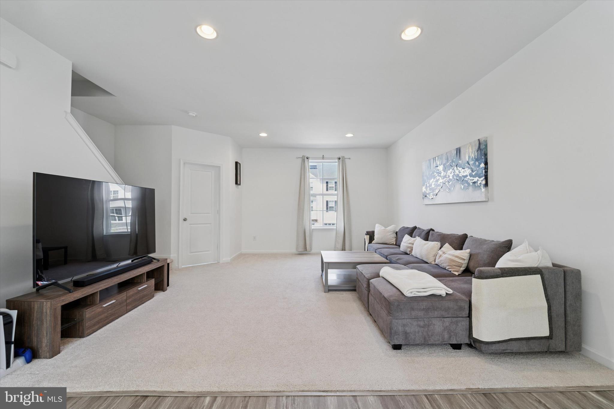 65 Aviary Road Thorofare, NJ 08086 - Photo 4 of 16 a living room with furniture and a flat screen tv