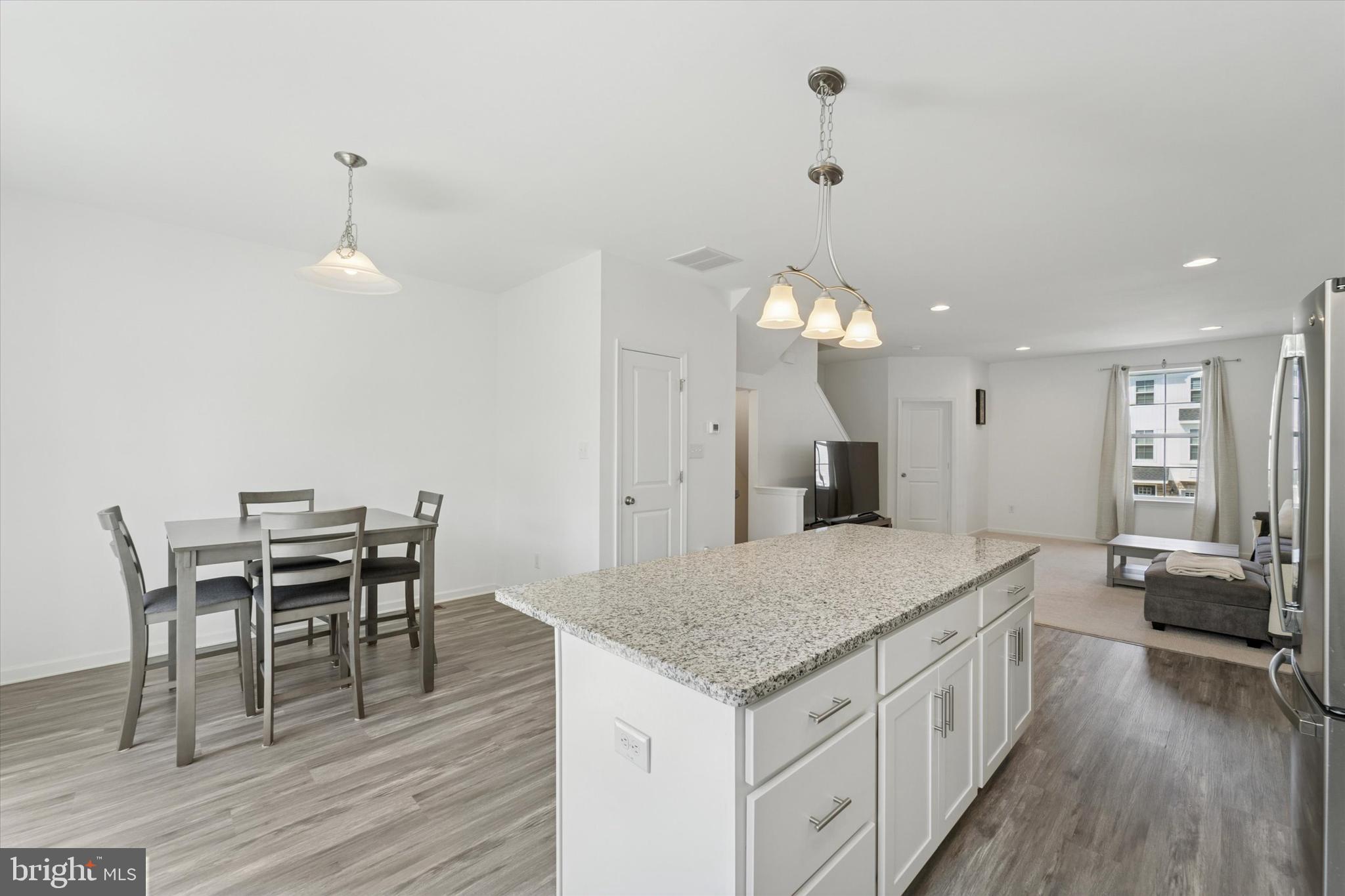 65 Aviary Road Thorofare, NJ 08086 - Photo 8 of 16 a kitchen with a table and chairs in it