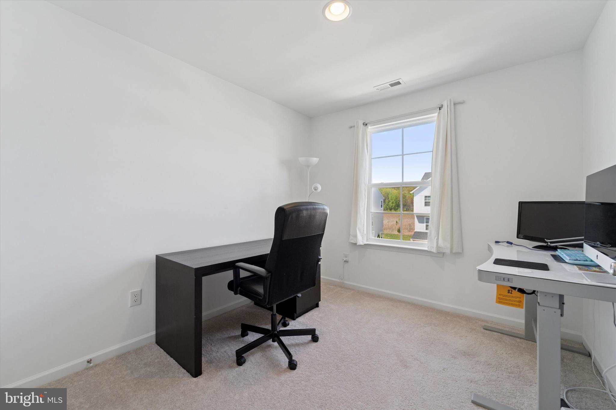 65 Aviary Road Thorofare, NJ 08086 - Photo 9 of 16 a view of a workspace with furniture and a window