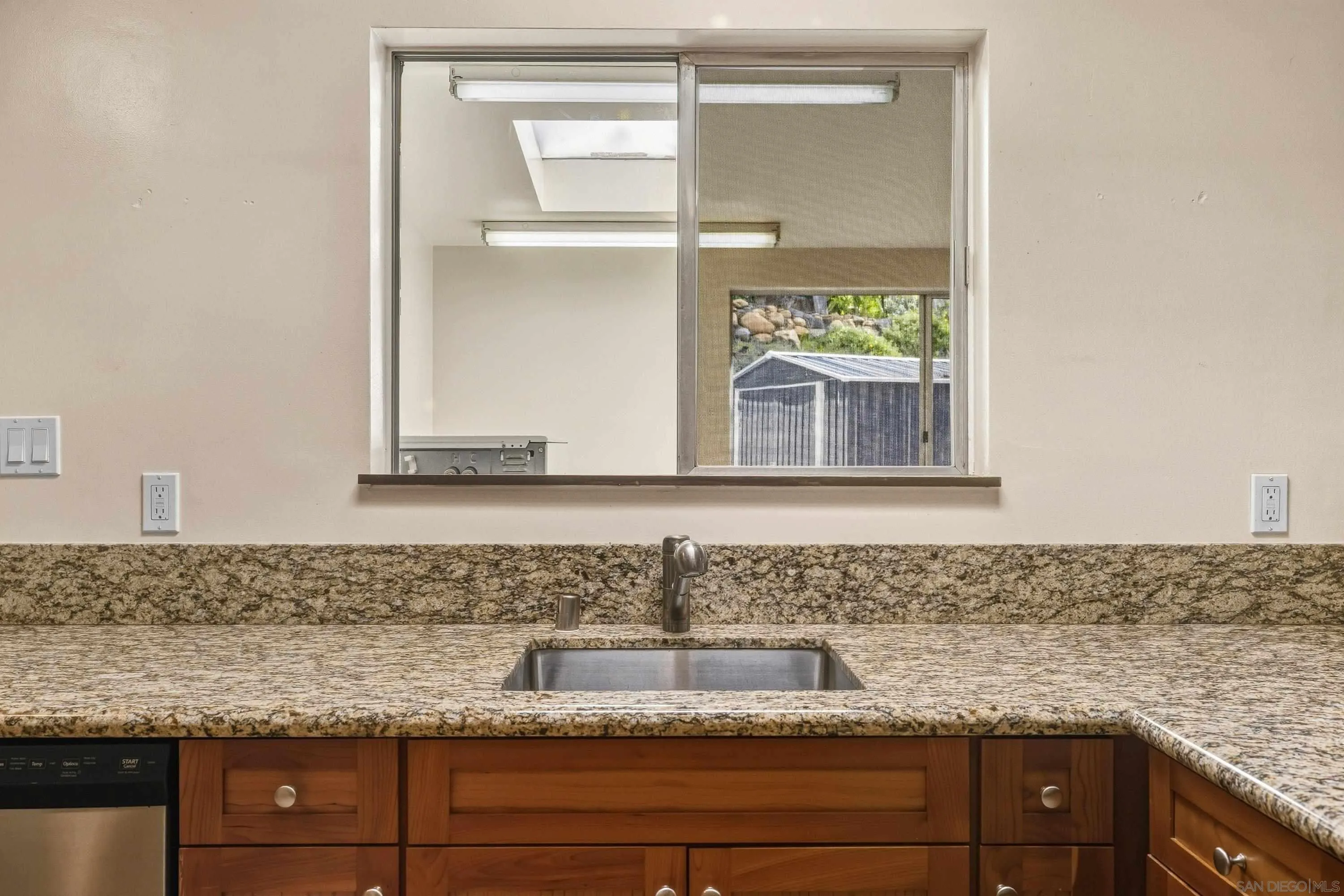1491 Louise Drive Alpine, CA 91901 - Photo 16 of 45 a bathroom with a granite countertop sink and mirror