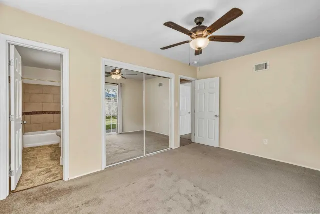 a view of a room that has a large window