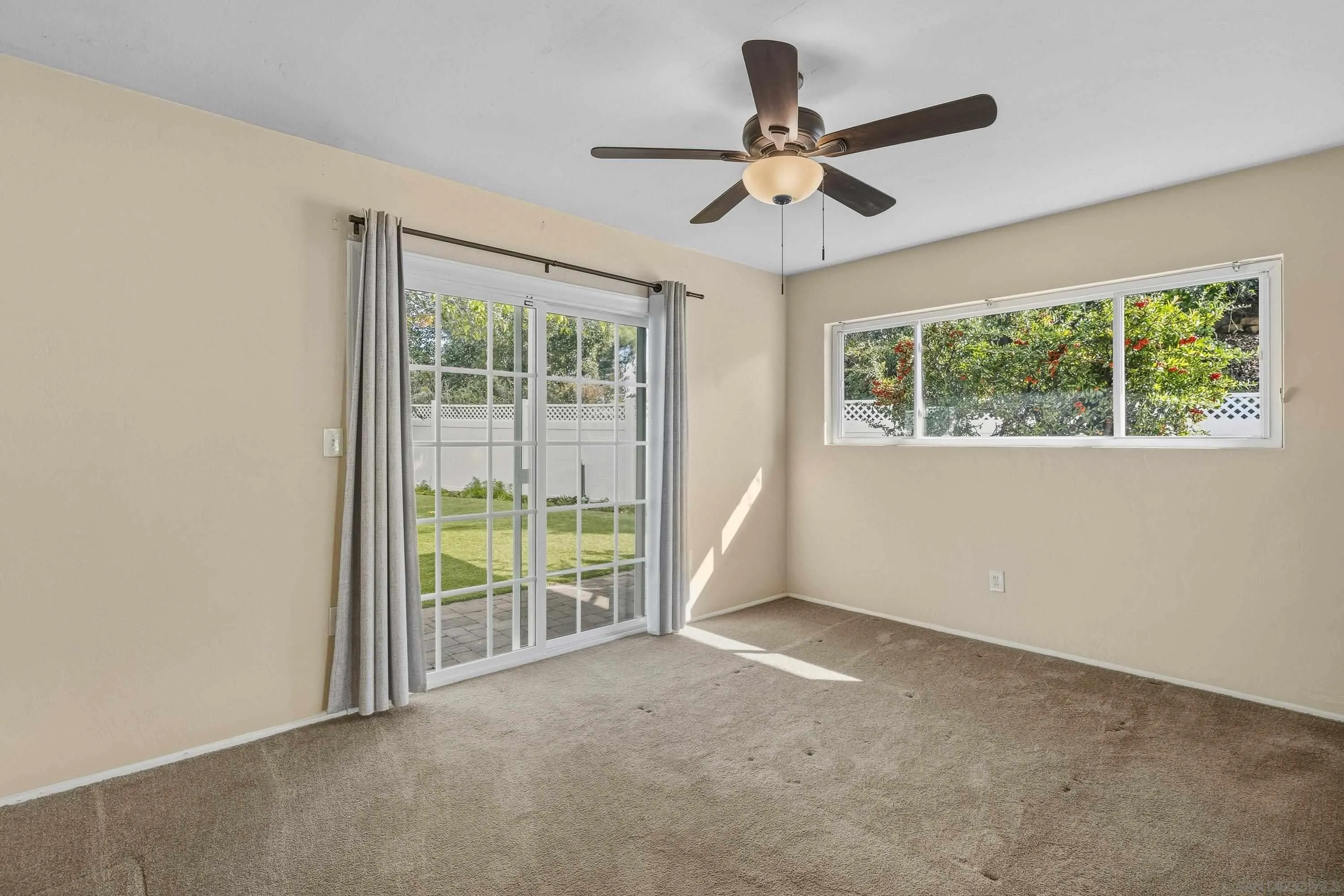 1491 Louise Drive Alpine, CA 91901 - Photo 29 of 45 a view of a livingroom with a ceiling fan and a large window