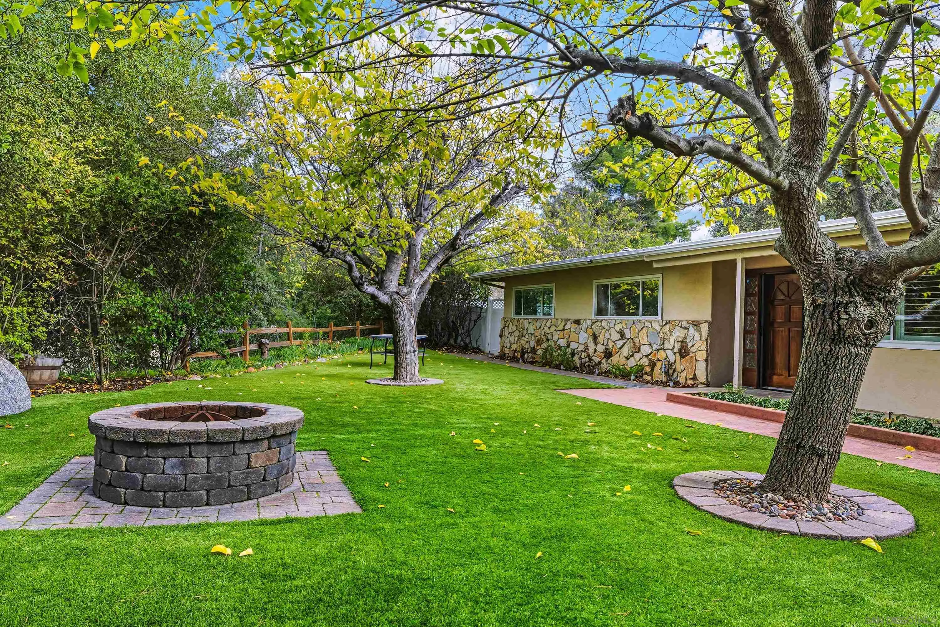 1491 Louise Drive Alpine, CA 91901 - Photo 4 of 45 a front view of a house with a yard and green space