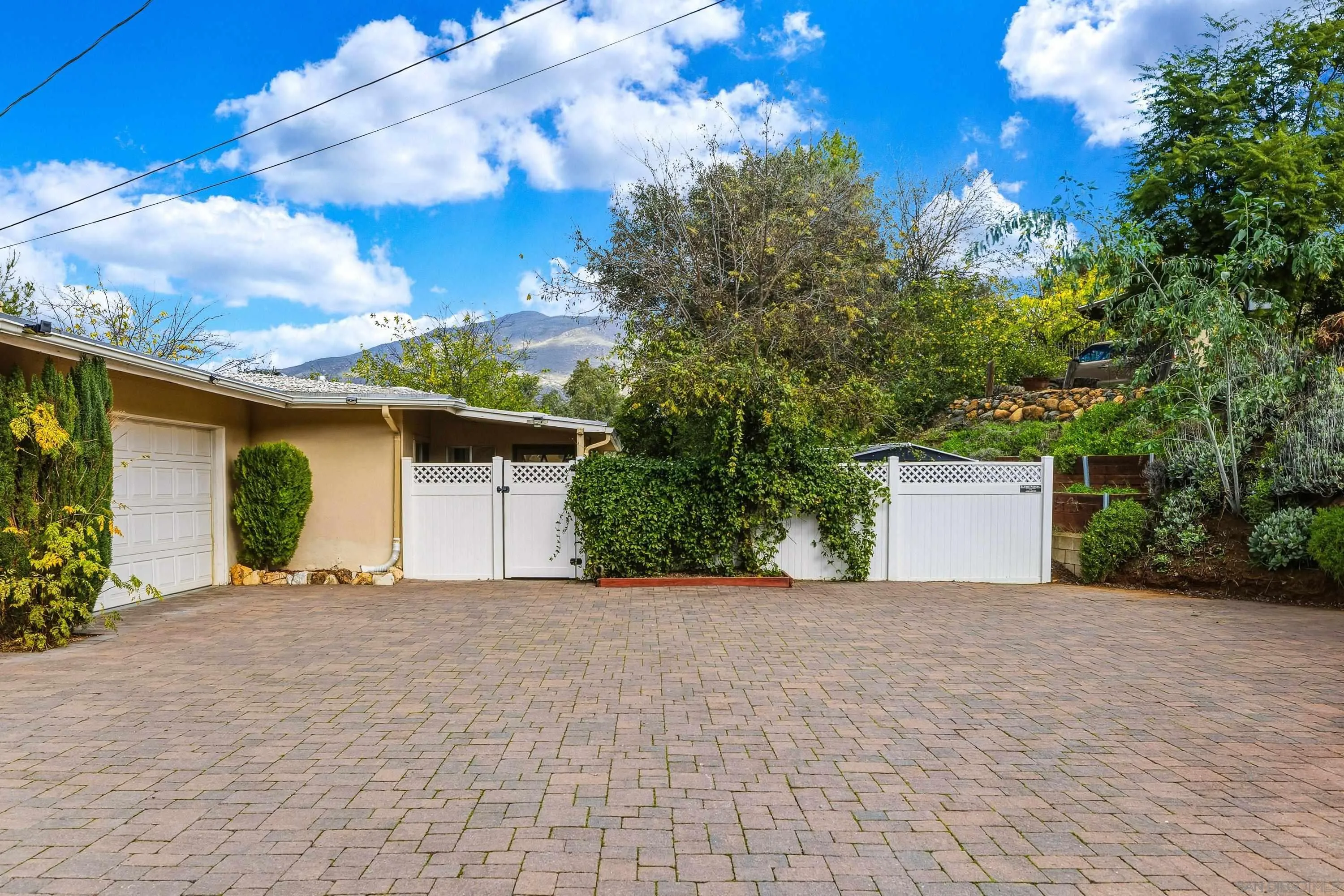 1491 Louise Drive Alpine, CA 91901 - Photo 43 of 45 a view of a house with a yard and garage