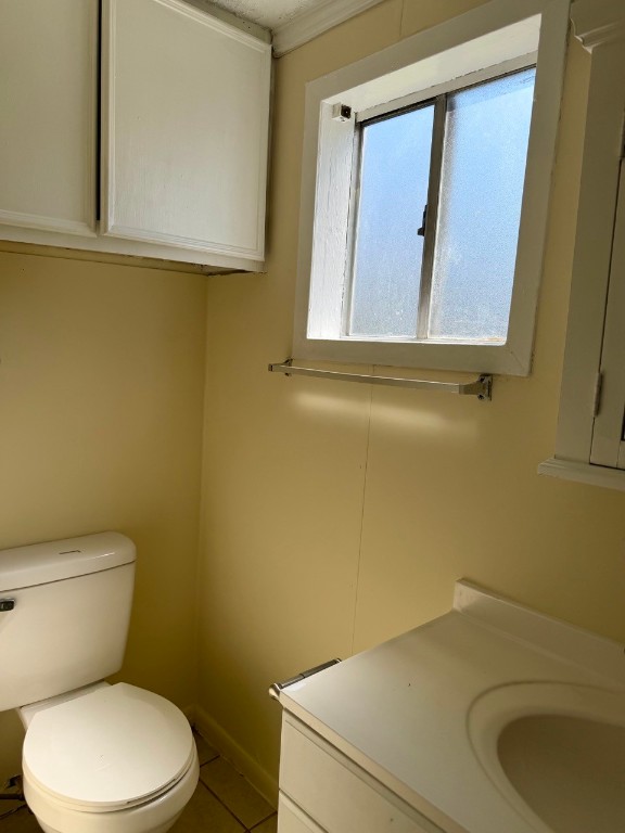 1608 Dyer Avenue Rosenberg, TX 77471 - Photo 9 of 16 a bathroom with a toilet sink and mirror