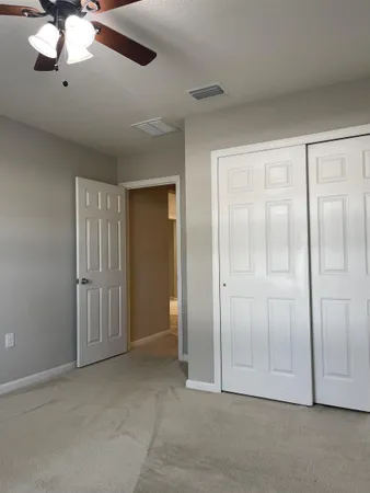 an empty room with fan