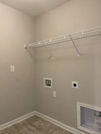 a view of a room with racks on the wall