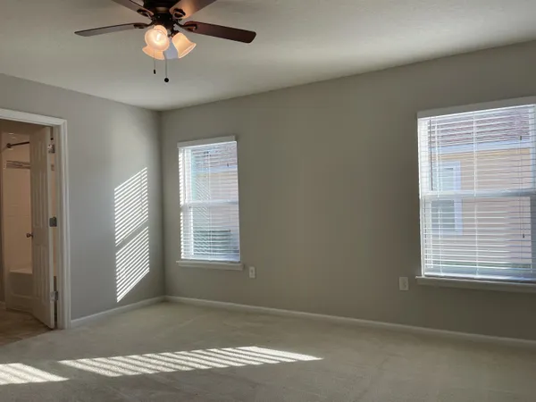 a view of an empty room with a window