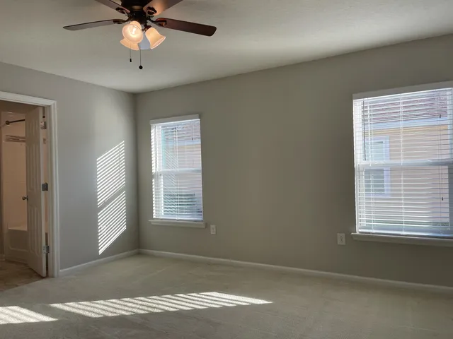 a view of an empty room with a window