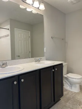 a bathroom with a sink and a toilet