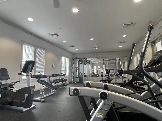 a view of a swimming pool with outdoor seating