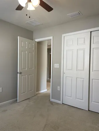 an empty room with fan