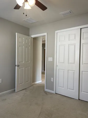 an empty room with fan