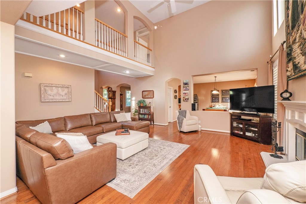 14251 Ashton Lane Riverside, CA 92508 - Photo 12 of 69 a living room with furniture a flat screen tv and kitchen view