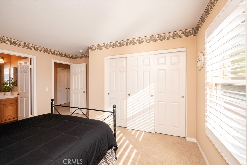 14251 Ashton Lane Riverside, CA 92508 - Photo 42 of 69 a bedroom with a bed and a window