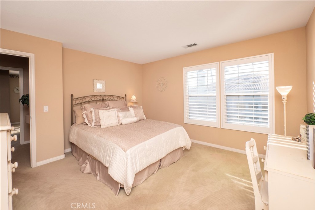 14251 Ashton Lane Riverside, CA 92508 - Photo 44 of 69 a bedroom with a large bed and a large window