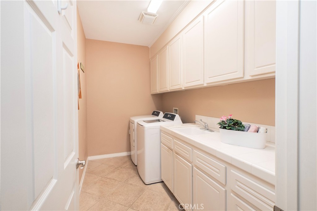 14251 Ashton Lane Riverside, CA 92508 - Photo 50 of 69 a utility room with dryer and washer