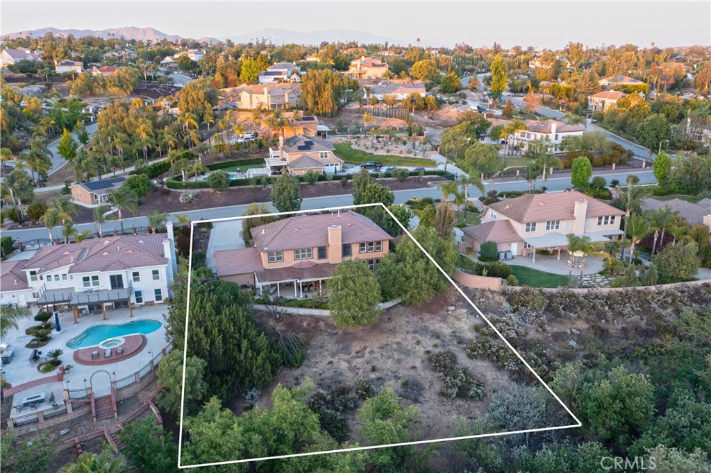 14251 Ashton Lane Riverside, CA 92508 - Photo 65 of 69 an aerial view of residential houses with outdoor space and parking