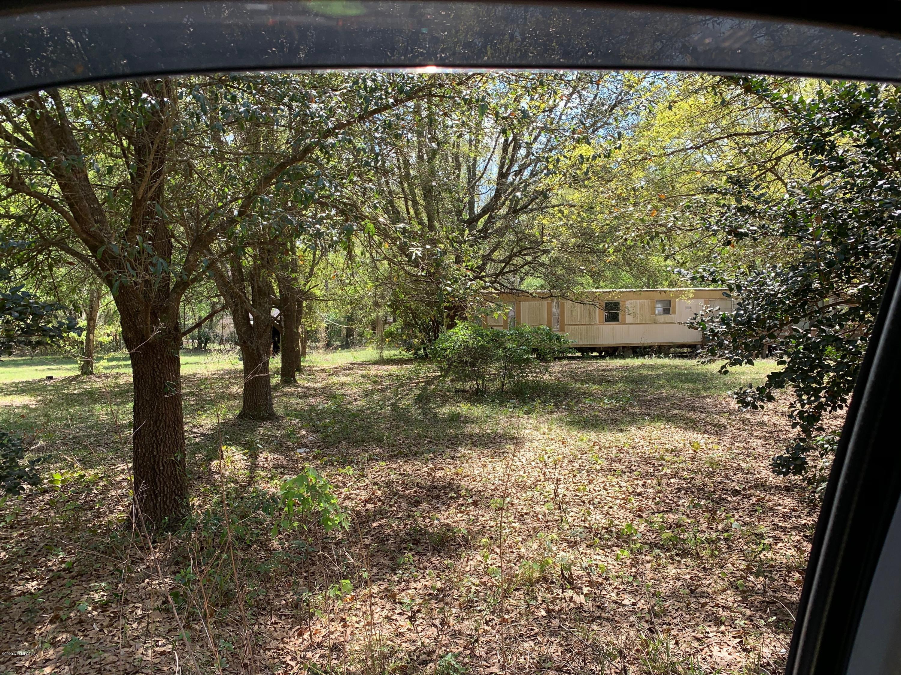 1358 Long Bay Road Middleburg, FL 32068 - Photo 8 of 16 a view of a yard with an outdoor seating