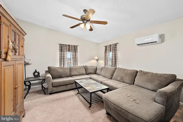 a living room with furniture and a window