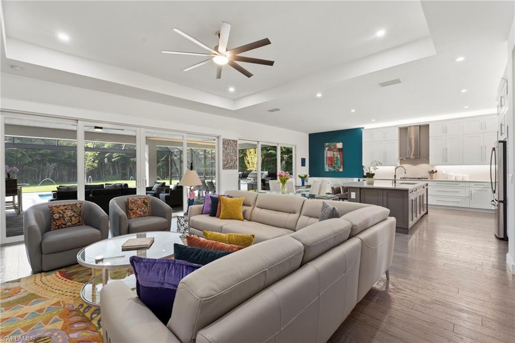 12083 Azalea Way Naples, FL 34120 - Photo 5 of 48 Open concept great room, open to kitchen and dining.