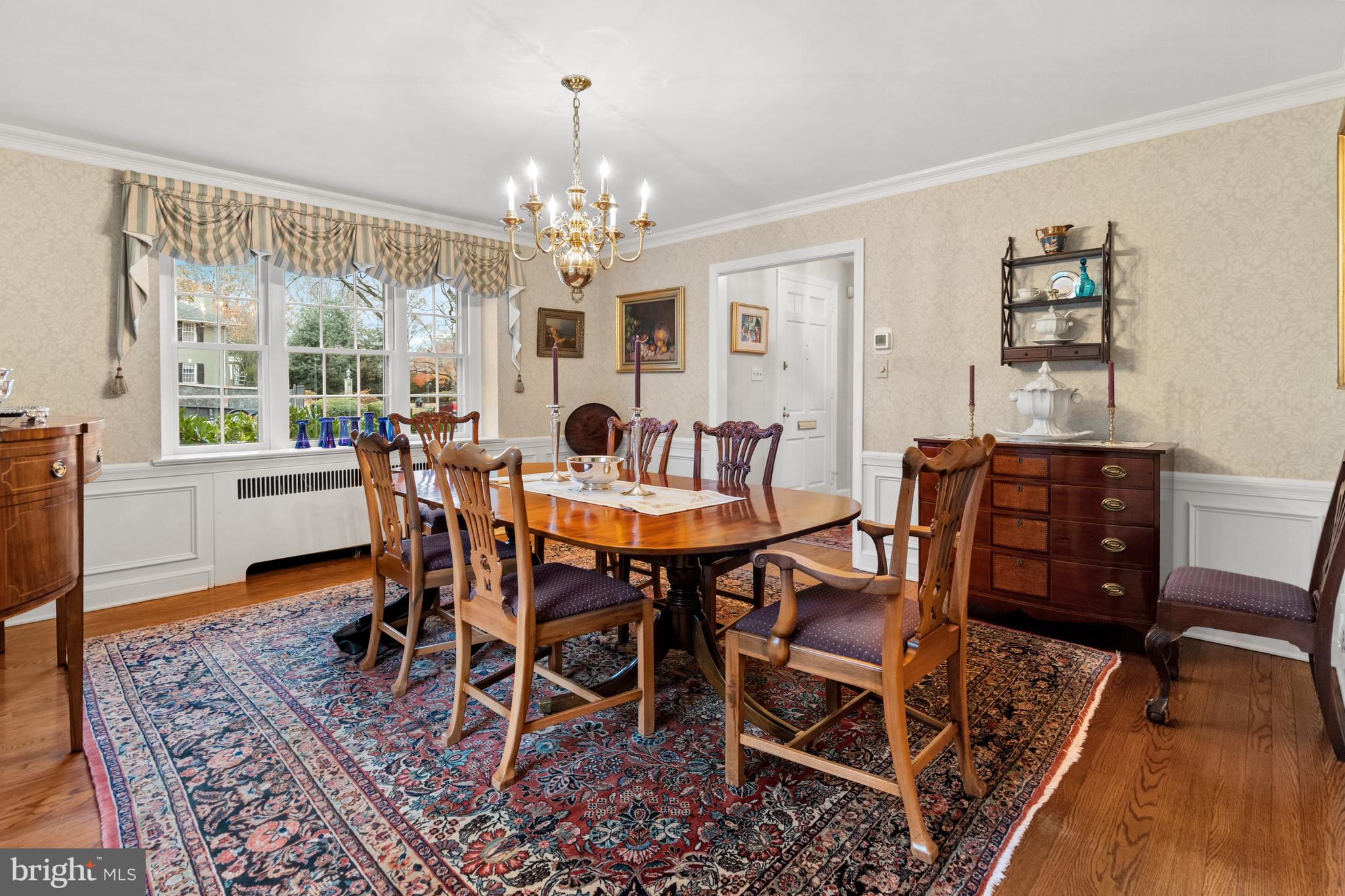 901 Stuart Road Wilmington, DE 19807 - Photo 9 of 58 a view of a dining room with furniture a chandelier and wooden floor