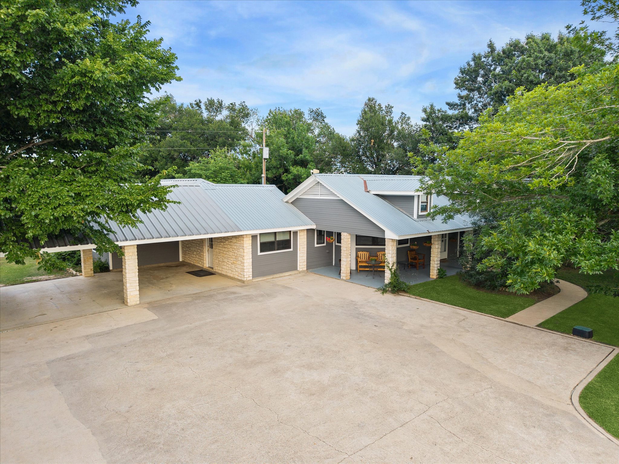 4451 County Road 467 Elgin, TX 78621 - Photo 1 of 1 This aerial shows the three-car carport, metal roof, mature trees for lots of shade! Parking for a party!