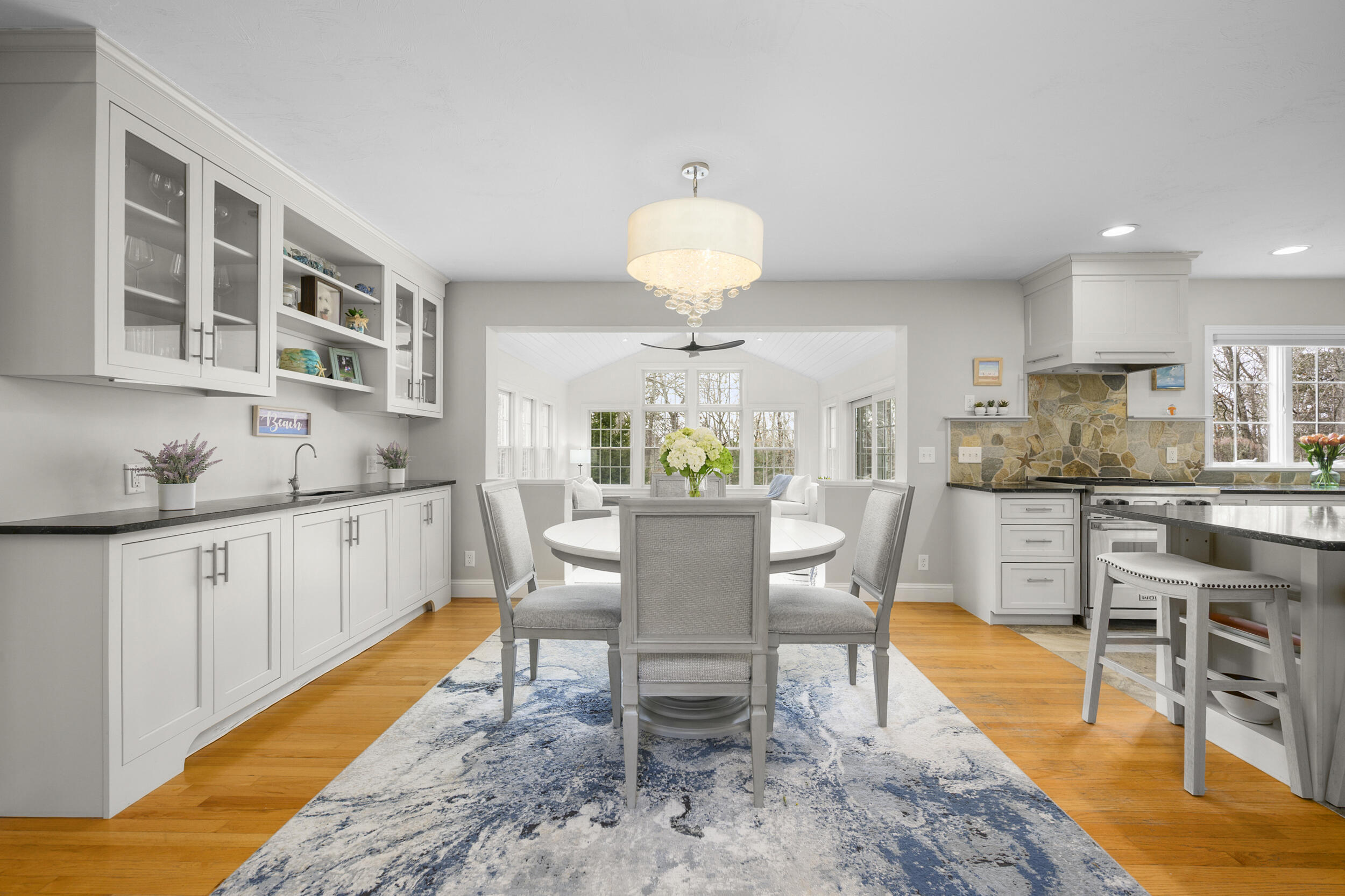 83 Cemetery Road Harwich, MA 02645 - Photo 13 of 53 a dining room with stainless steel appliances kitchen island granite countertop a table and chairs