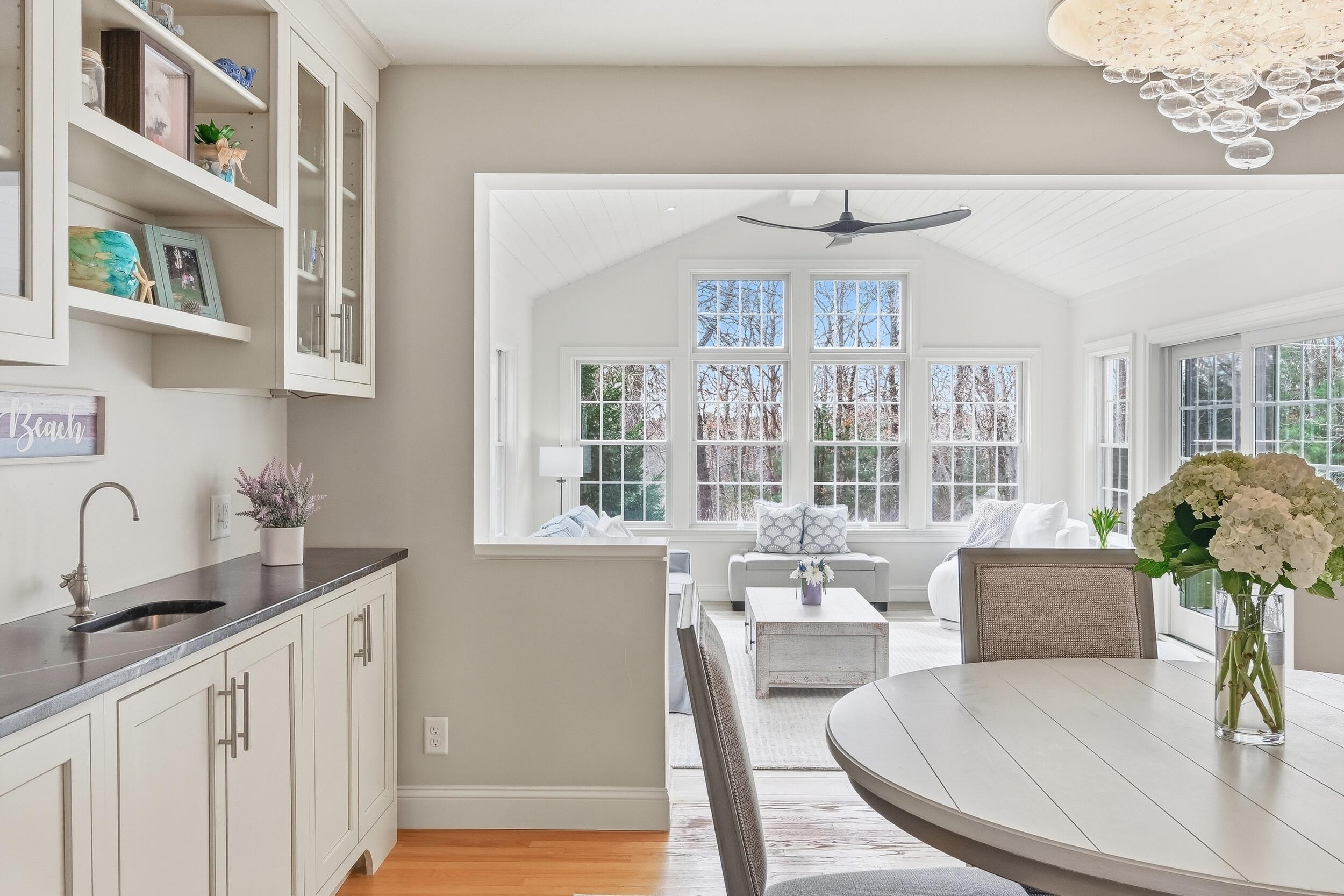 83 Cemetery Road Harwich, MA 02645 - Photo 14 of 53 a dining room with furniture a rug and wooden floor