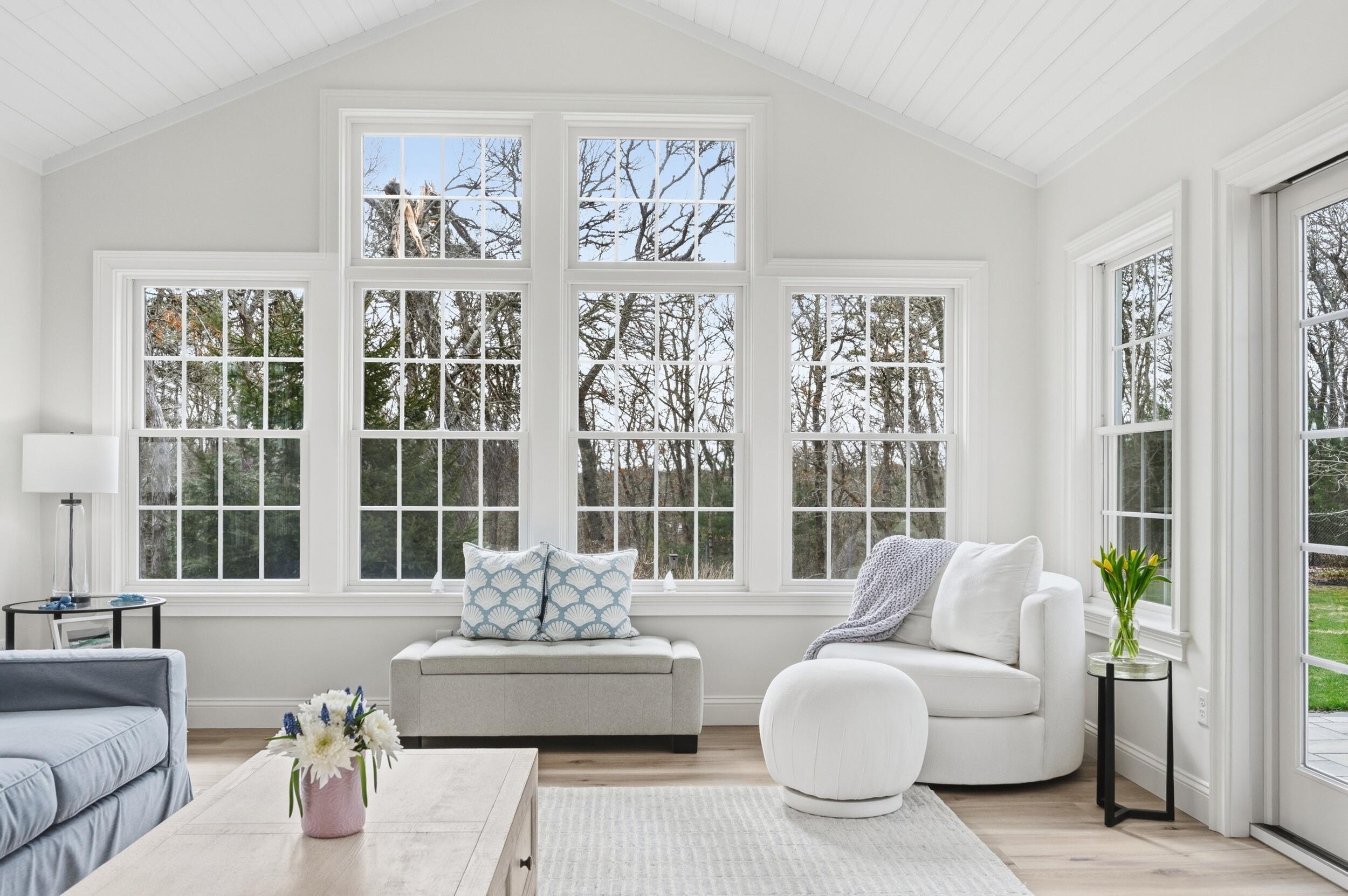 83 Cemetery Road Harwich, MA 02645 - Photo 16 of 53 a living room with furniture and floor to ceiling windows