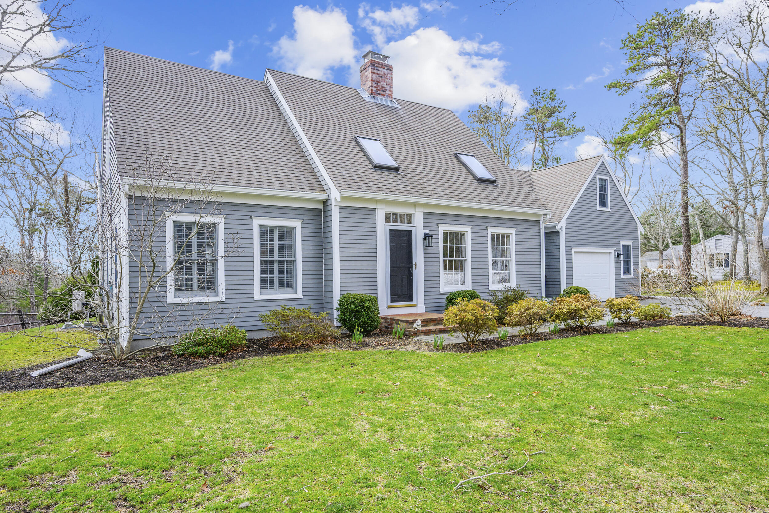 83 Cemetery Road Harwich, MA 02645 - Photo 2 of 53 a front view of house with yard and green space
