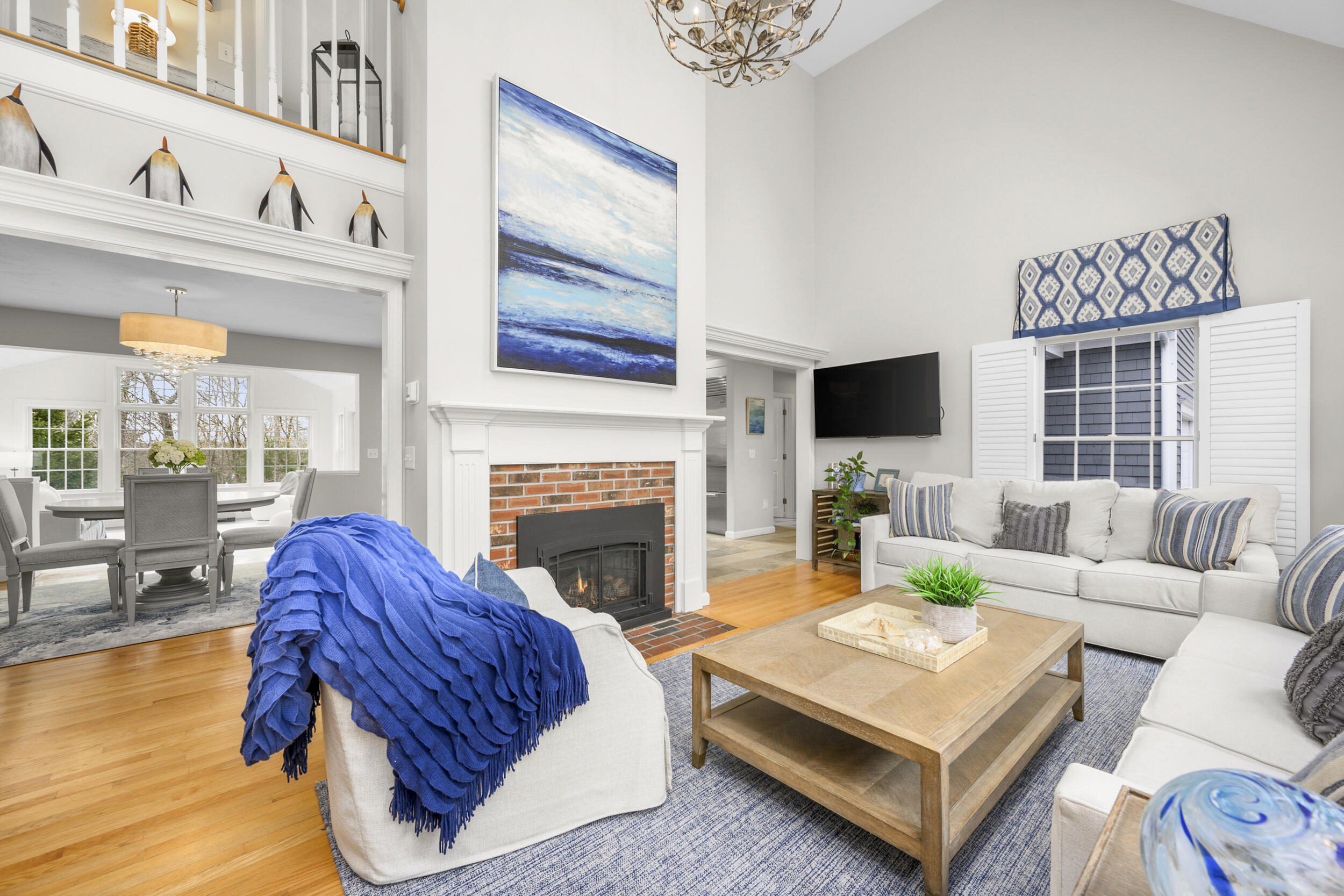 83 Cemetery Road Harwich, MA 02645 - Photo 25 of 53 a living room with furniture a fireplace and a flat screen tv
