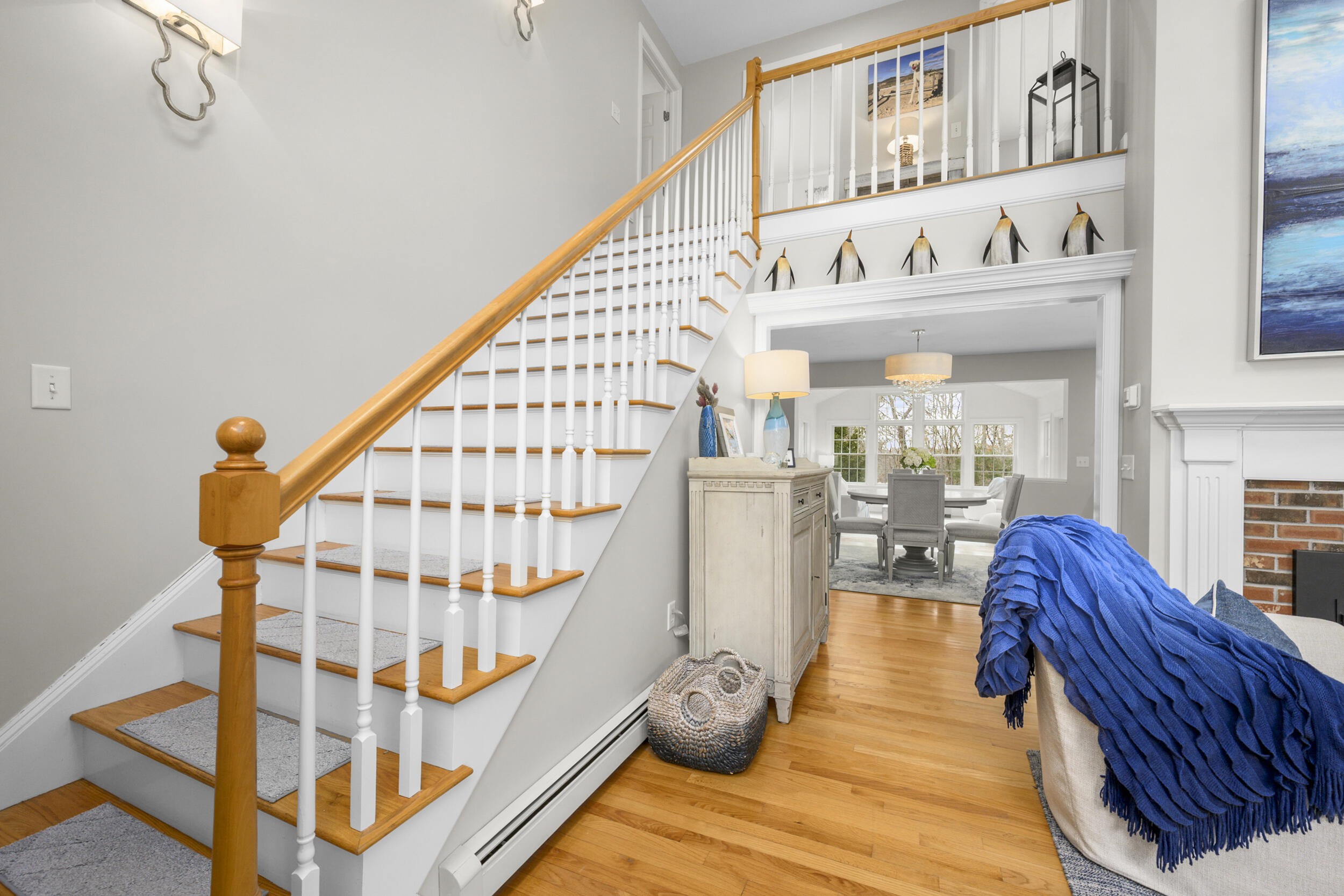 83 Cemetery Road Harwich, MA 02645 - Photo 31 of 53 a view of entryway dining room and hall with wooden floor