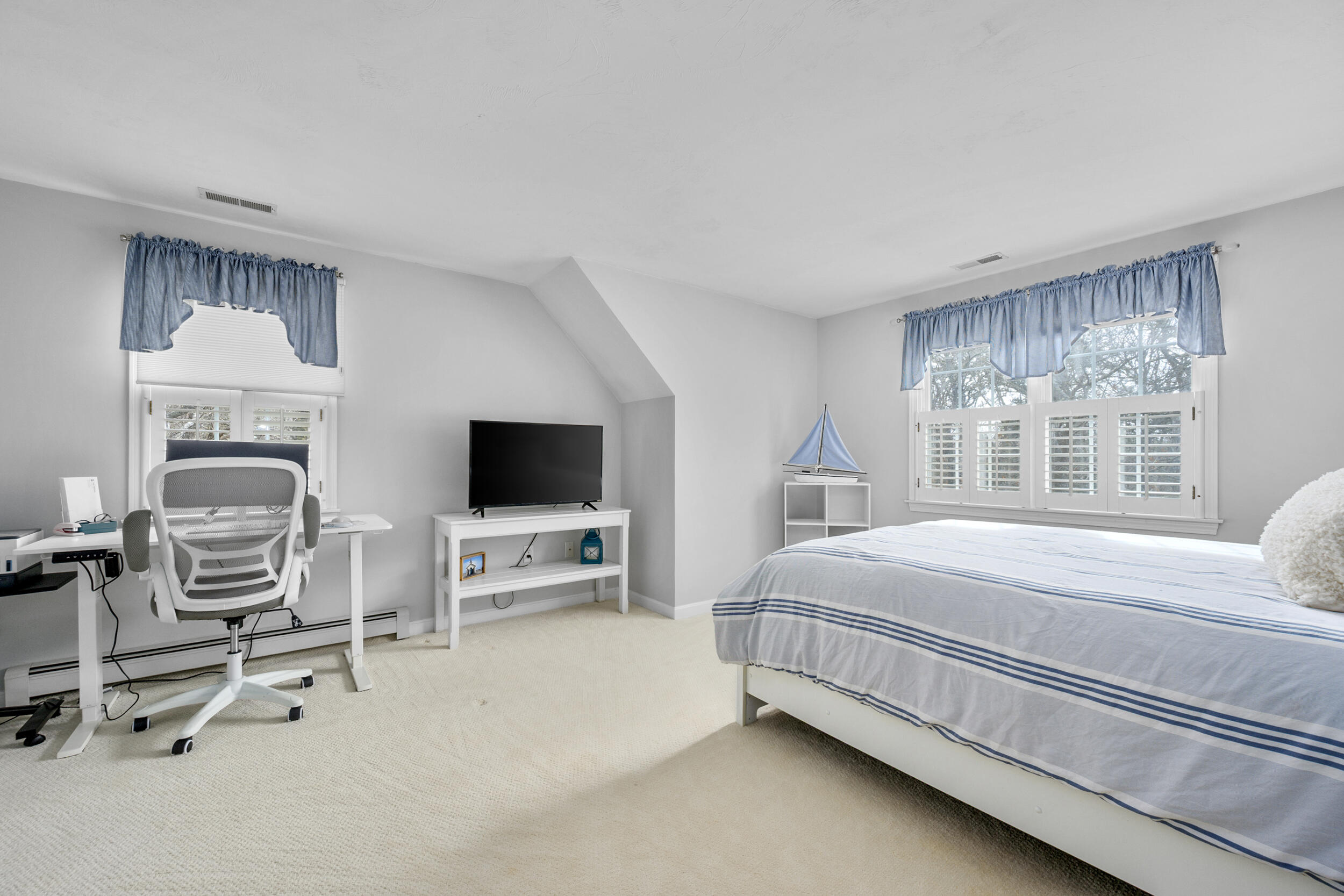 83 Cemetery Road Harwich, MA 02645 - Photo 33 of 53 a bed room with furniture and a flat screen tv