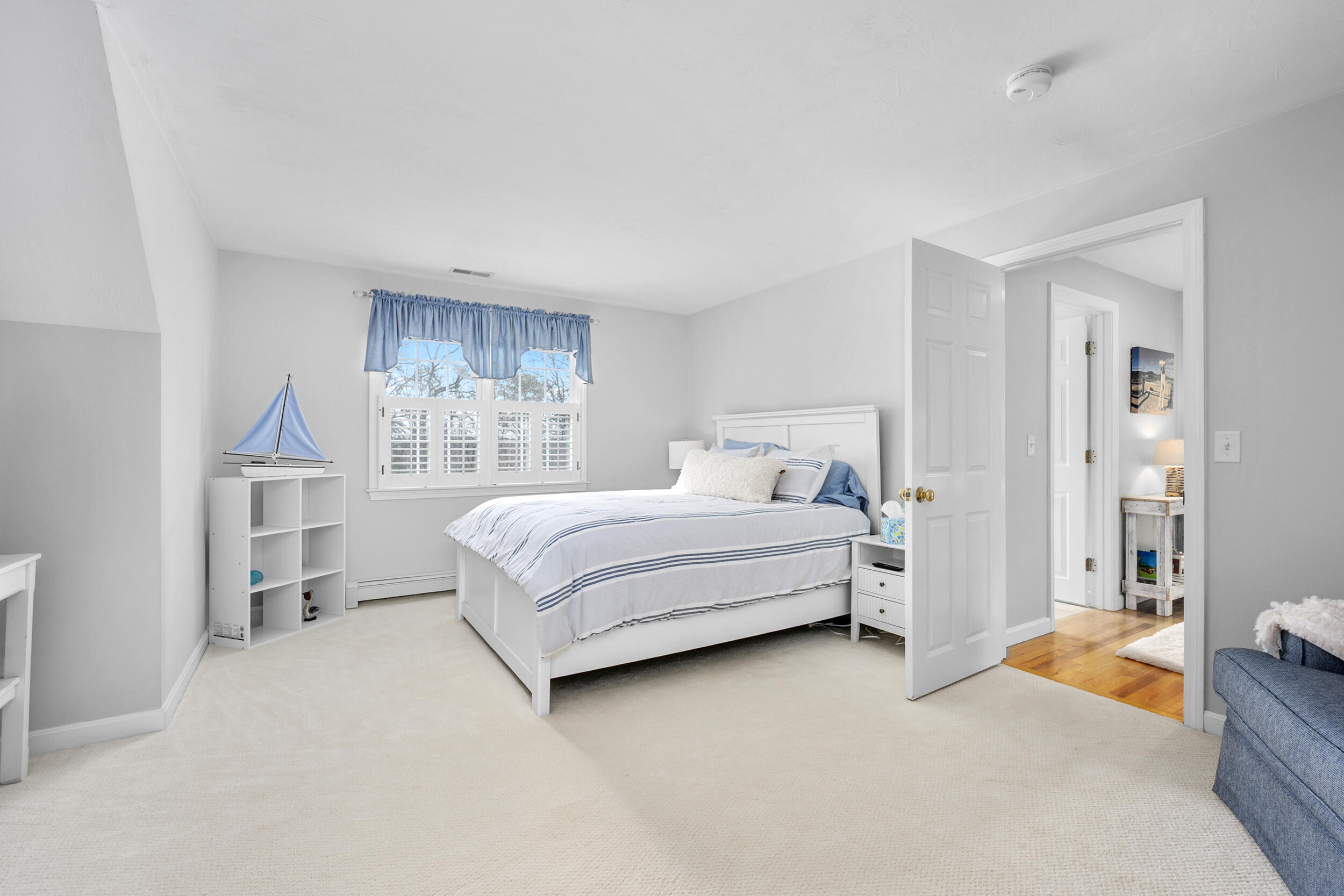 83 Cemetery Road Harwich, MA 02645 - Photo 34 of 53 a bedroom with a bed and a large window