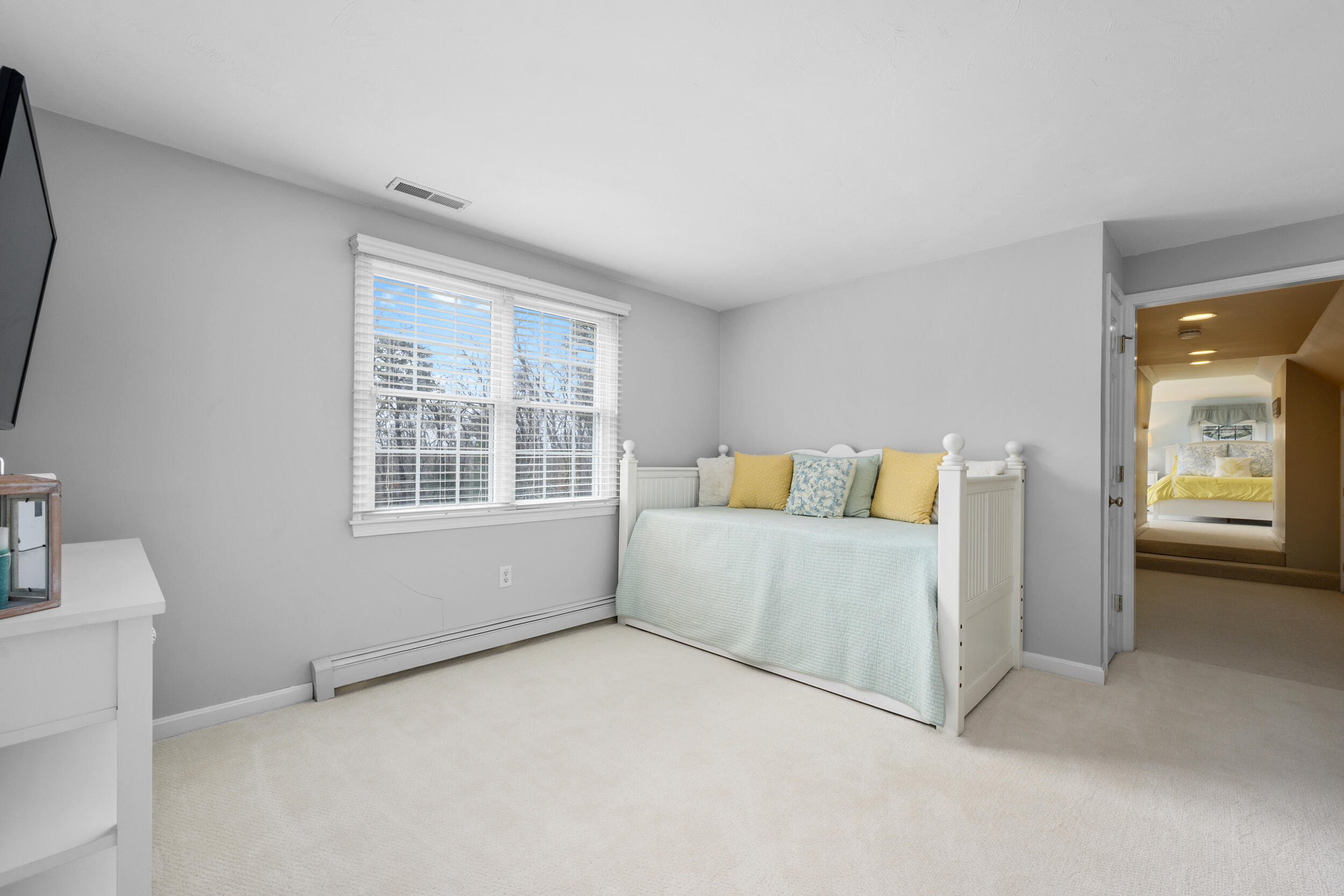 83 Cemetery Road Harwich, MA 02645 - Photo 36 of 53 a spacious bedroom with a bed and a window