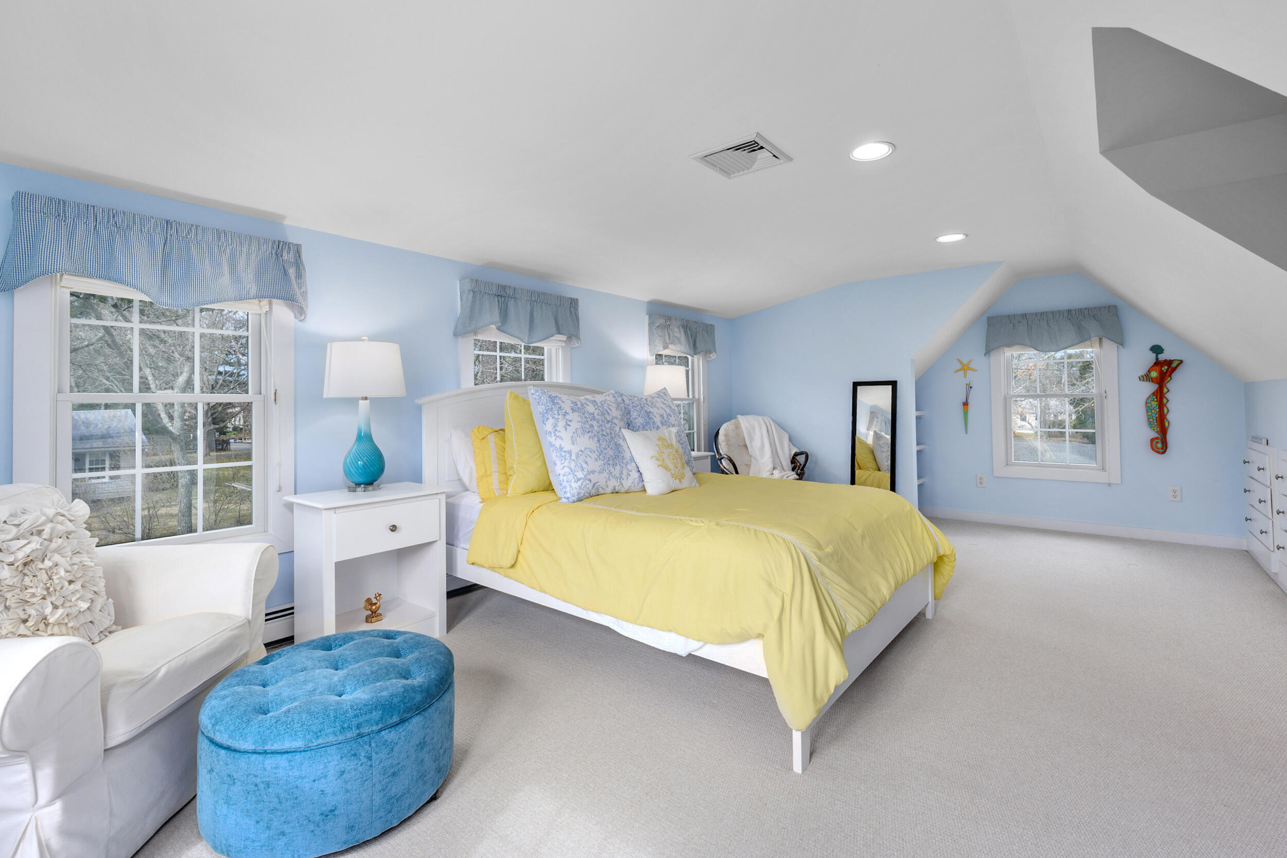 83 Cemetery Road Harwich, MA 02645 - Photo 40 of 53 a spacious bedroom with a bed and a couch